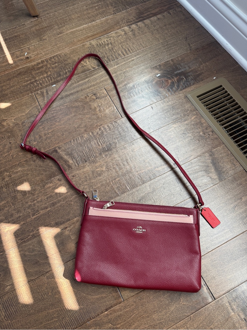 Coach Burgundy Crossbody with Light Pink Zip Accent